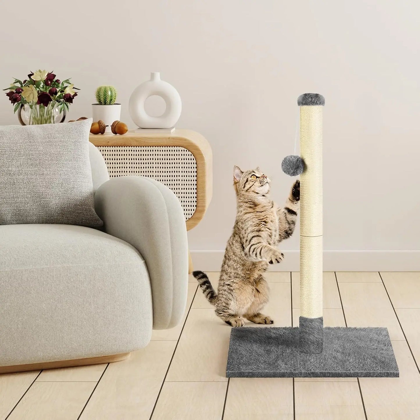 Cat scratching post with a sisal rope and a hanging ball